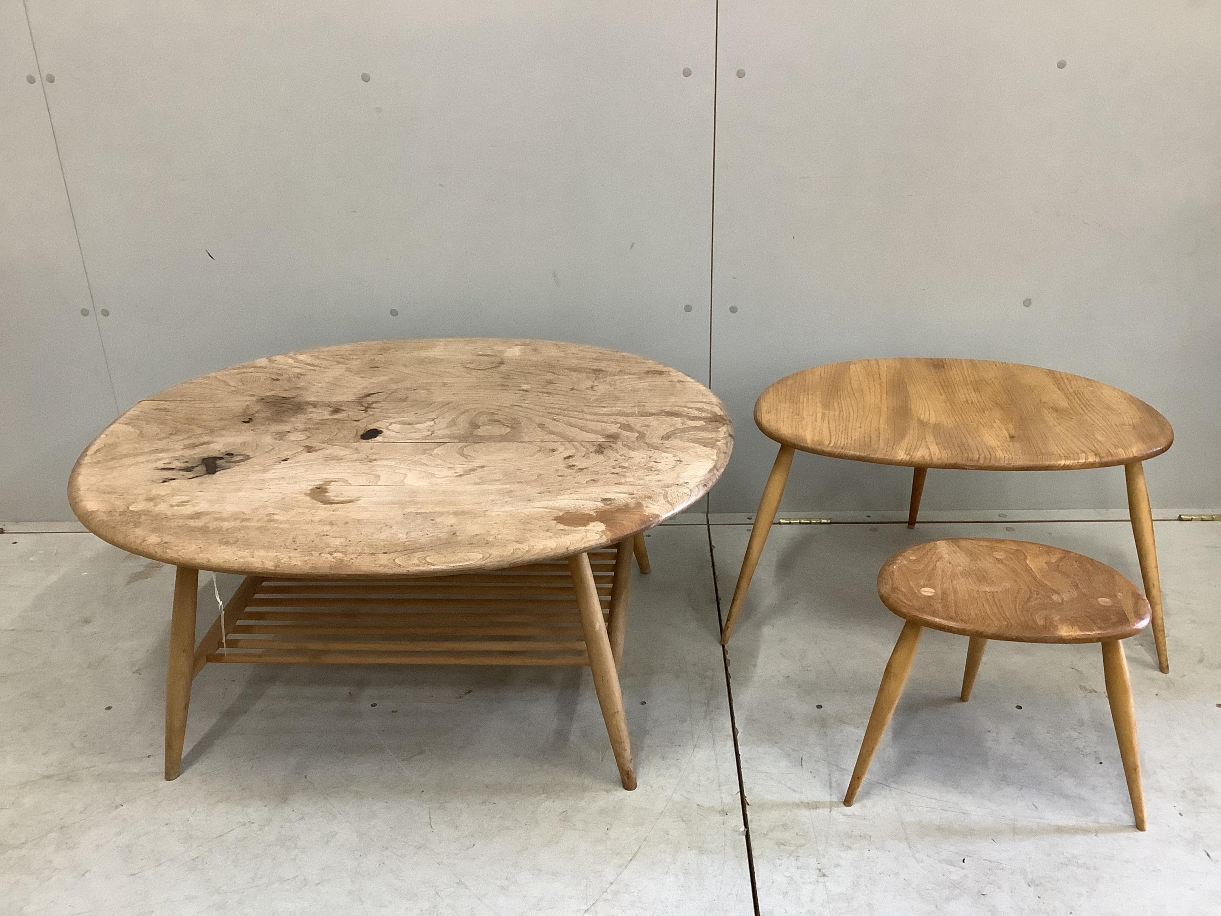 An Ercol oval elm coffee table and a nest of two tables, largest width 98cm, depth 84cm, height 44cm. Condition - poor